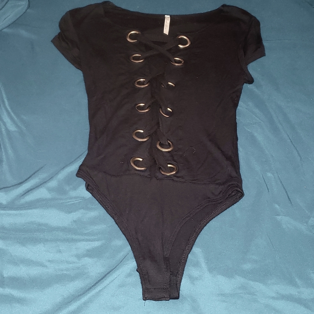 Cut open criss-cross body suit